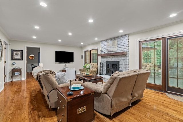 124 Hidden Oaks Dr, Barrington, IL 60010 - living room featuring crown molding, light wood-type flooring, recessed lighting, and a fireplace