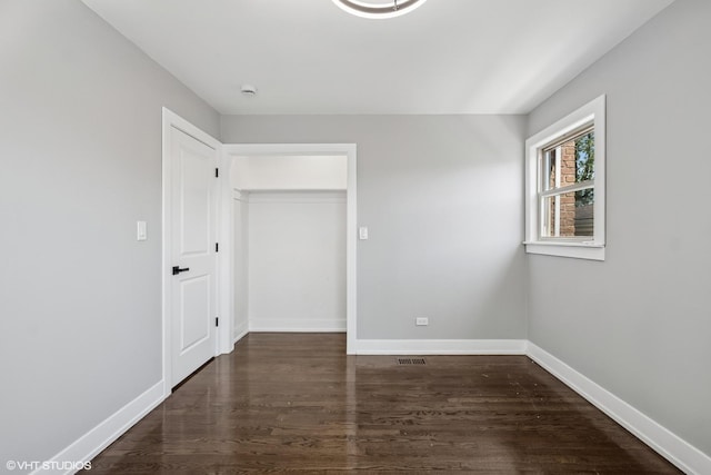 12830 S Carpenter St, Calumet Park, IL 60827 - unfurnished bedroom with wood finished floors and baseboards