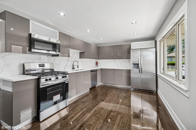 12830 S Carpenter St, Calumet Park, IL 60827 - kitchen with stainless steel appliances, gray cabinets, modern cabinets, dark wood-style flooring, and decorative backsplash