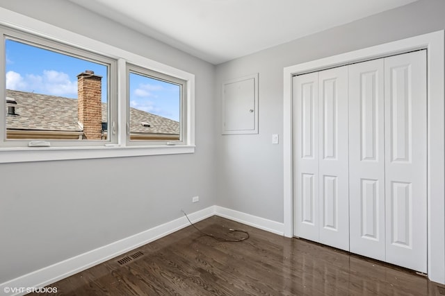 12830 S Carpenter St, Calumet Park, IL 60827 - unfurnished bedroom featuring dark wood-style flooring and a closet