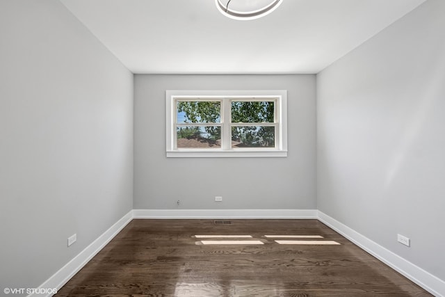 12830 S Carpenter St, Calumet Park, IL 60827 - empty room with wood finished floors and baseboards