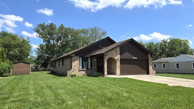 7121 Oak Grove Ave, Justice, IL 60458 - view of front of home featuring brick siding, a garage, and concrete driveway