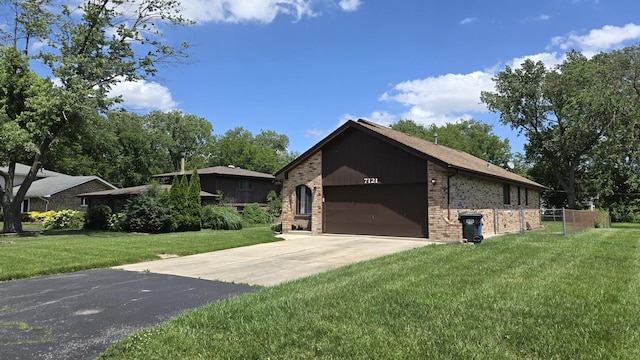 7121 Oak Grove Ave, Justice, IL 60458 - view of front of house with brick siding, an attached garage, and concrete driveway