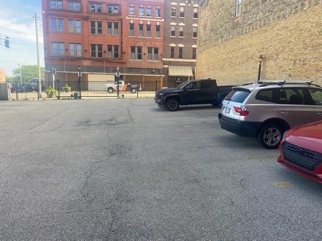 212 N Center St Unit 205, Bloomington, IL 61701 - view of uncovered parking lot