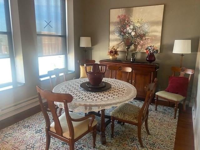 212 N Center St Unit 205, Bloomington, IL 61701 - dining area featuring plenty of natural light and wood finished floors