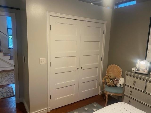 212 N Center St Unit 205, Bloomington, IL 61701 - bedroom with dark wood-type flooring and a closet