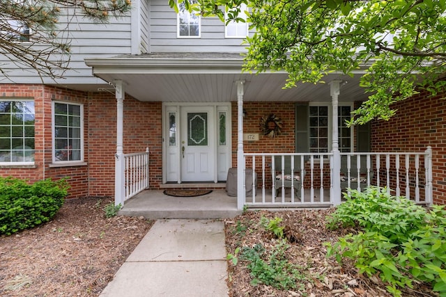 172 Hamilton Ave, Frankfort, IL 60423 - property entrance featuring a porch and brick siding