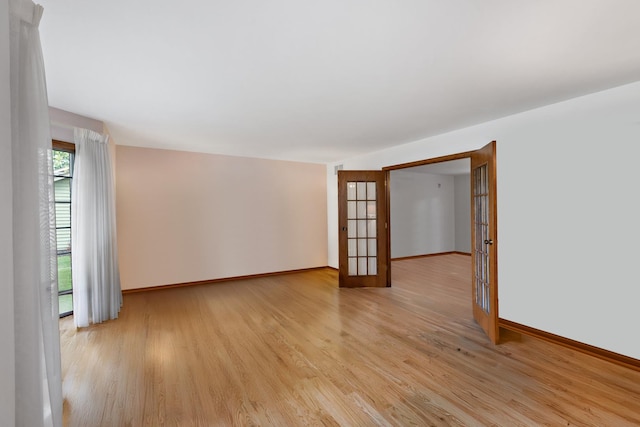 172 Hamilton Ave, Frankfort, IL 60423 - empty room featuring french doors and light wood finished floors