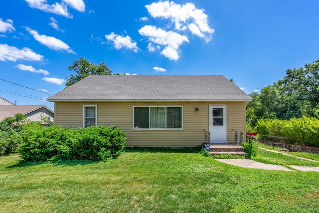 1716 Court St, Mchenry, IL 60050 - bungalow-style home featuring a front lawn