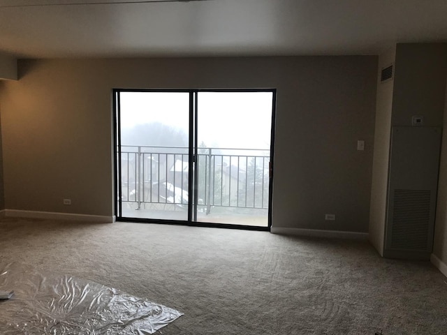 6340 Americana Dr Unit 705, Willowbrook, IL 60527 - unfurnished room featuring carpet flooring and baseboards