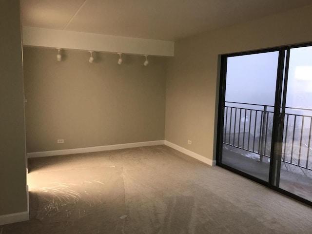 6340 Americana Dr Unit 705, Willowbrook, IL 60527 - carpeted spare room with baseboards and track lighting