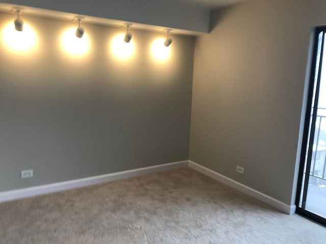 6340 Americana Dr Unit 705, Willowbrook, IL 60527 - spare room featuring carpet and baseboards