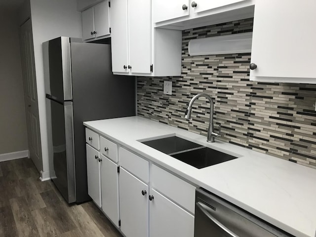6340 Americana Dr Unit 705, Willowbrook, IL 60527 - kitchen featuring decorative backsplash, stainless steel dishwasher, dark wood-style flooring, and light countertops