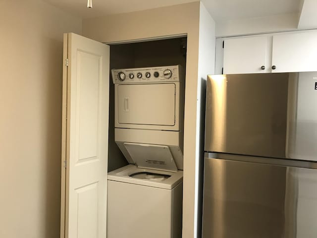 6340 Americana Dr Unit 705, Willowbrook, IL 60527 - washroom with stacked washer / drying machine