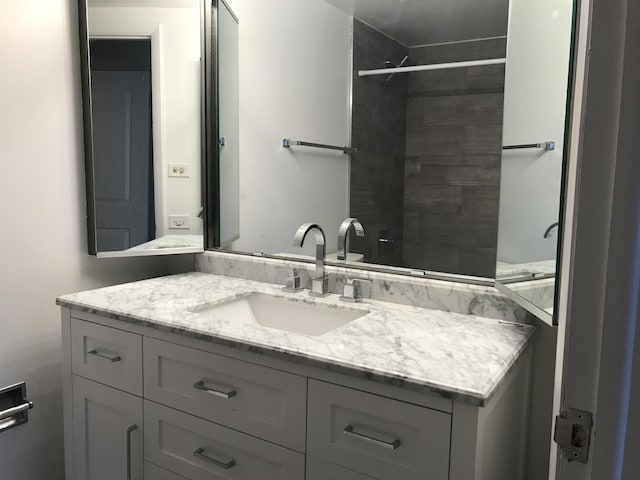 6340 Americana Dr Unit 705, Willowbrook, IL 60527 - bathroom with vanity and a tile shower
