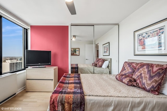 1560 N Sandburg Ter Unit 4301-4303, Chicago, IL 60610 - bedroom with wood finished floors, a closet, and a ceiling fan