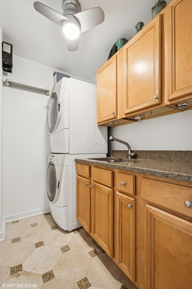 1560 N Sandburg Ter Unit 4301-4303, Chicago, IL 60610 - laundry area featuring estacked washer and dryer, cabinet space, a ceiling fan, and light tile patterned floors