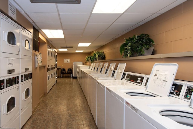 1560 N Sandburg Ter Unit 4301-4303, Chicago, IL 60610 - shared laundry with stacked washer and clothes dryer, washer and clothes dryer, and concrete block wall
