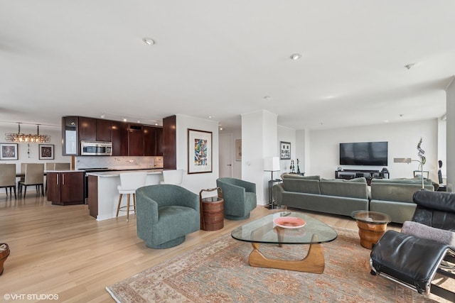 1560 N Sandburg Ter Unit 4301-4303, Chicago, IL 60610 - living area with light wood-style flooring and rail lighting