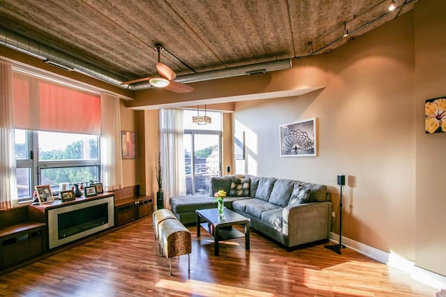3201 W Leland Ave Unit 406, Chicago, IL 60625 - living area with wood finished floors, rail lighting, and a ceiling fan