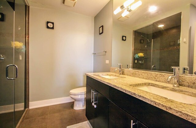 3201 W Leland Ave Unit 406, Chicago, IL 60625 - bathroom featuring double vanity, a shower stall, and tile patterned floors