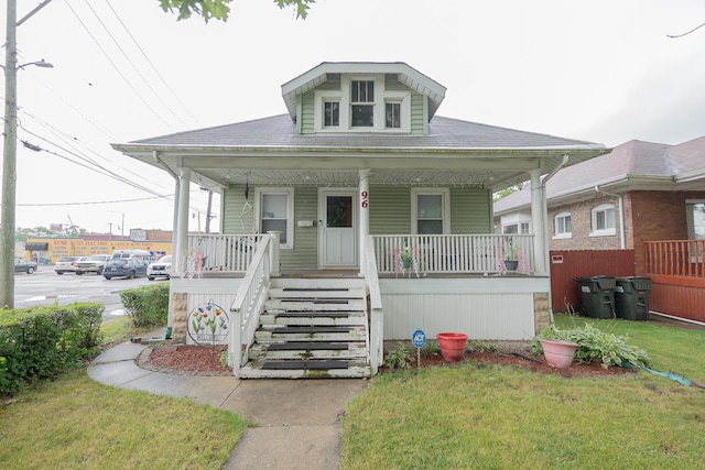 96 Interocean Ave, South Chicago Heights, IL 60411 - bungalow-style house featuring a porch, a front lawn, and stairs