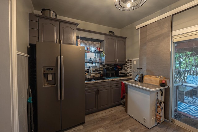 96 Interocean Ave, South Chicago Heights, IL 60411 - kitchen with stainless steel refrigerator with ice dispenser, wood finished floors, and backsplash