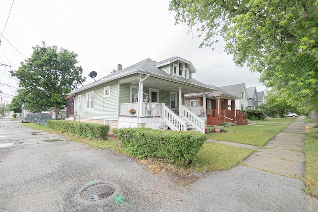 96 Interocean Ave, South Chicago Heights, IL 60411 - bungalow with a porch, a chimney, and stairs