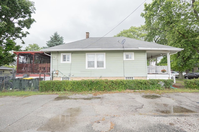 96 Interocean Ave, South Chicago Heights, IL 60411 - view of property exterior with a chimney and a porch