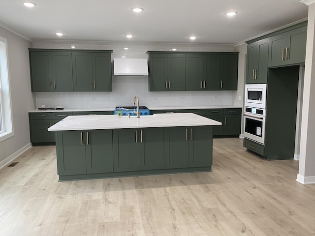 24433 W Bantry Ln, Shorewood, IL 60404 - kitchen with white appliances, green cabinets, tasteful backsplash, crown molding, and wall chimney exhaust hood