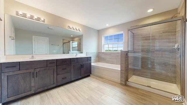 24433 W Bantry Ln, Shorewood, IL 60404 - bathroom featuring double vanity, a garden tub, a shower stall, and recessed lighting