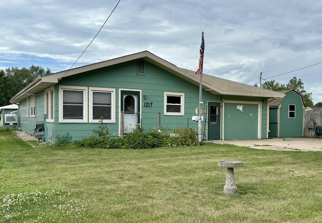 1217 Retz Dr, Ottawa, IL 61350 - view of front facade with an attached garage, a front yard, and concrete driveway