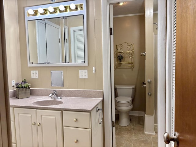 1217 Retz Dr, Ottawa, IL 61350 - bathroom featuring crown molding, vanity, tile patterned flooring, and a closet