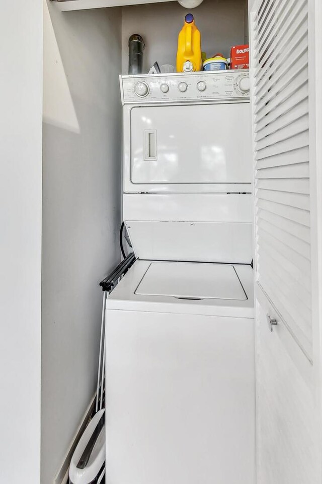 1740 N Maplewood Ave Unit 301, Chicago, IL 60647 - laundry area featuring stacked washer / dryer