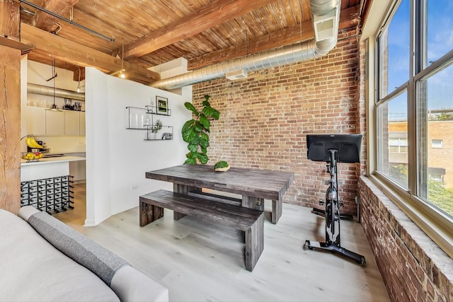 1740 N Maplewood Ave Unit 301, Chicago, IL 60647 - dining space with brick wall, a wood ceiling with exposed beams, and wood finished floors