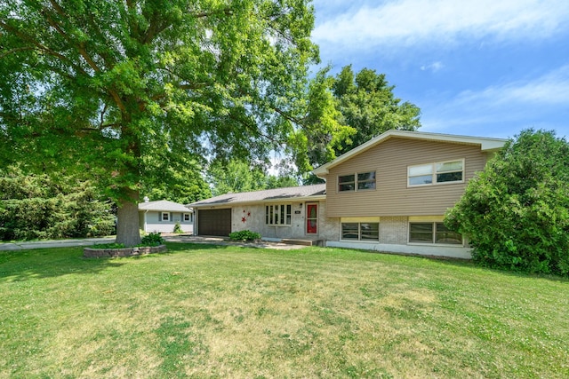 2689 Lynnville Ct, Lindenwood, IL 61049 - view of front of home with a garage, a front yard, and brick siding