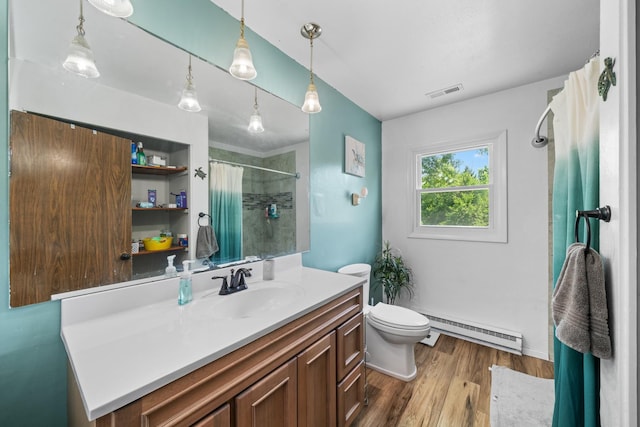 2689 Lynnville Ct, Lindenwood, IL 61049 - bathroom with a baseboard radiator, vanity, curtained shower, and wood finished floors