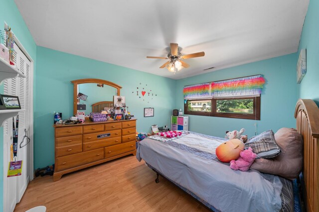 2689 Lynnville Ct, Lindenwood, IL 61049 - bedroom with light wood-style flooring, a closet, and a ceiling fan
