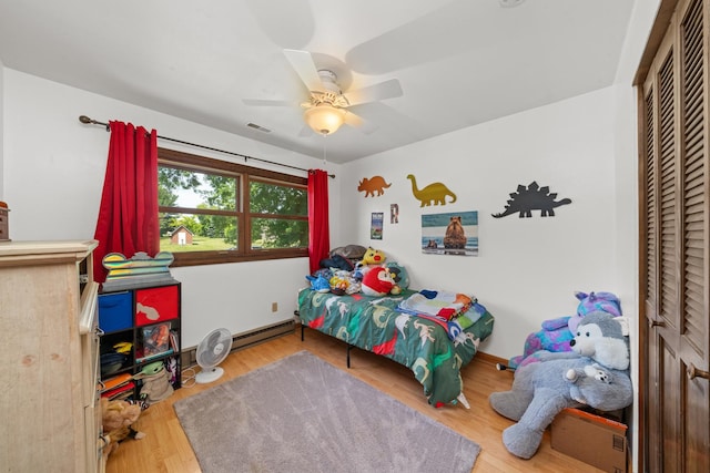 2689 Lynnville Ct, Lindenwood, IL 61049 - bedroom featuring a ceiling fan, wood finished floors, and a closet