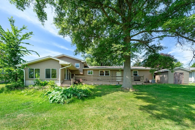 2689 Lynnville Ct, Lindenwood, IL 61049 - back of house featuring a shed, a yard, and a wooden deck