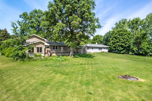 2689 Lynnville Ct, Lindenwood, IL 61049 - view of grassy yard featuring a wooden deck