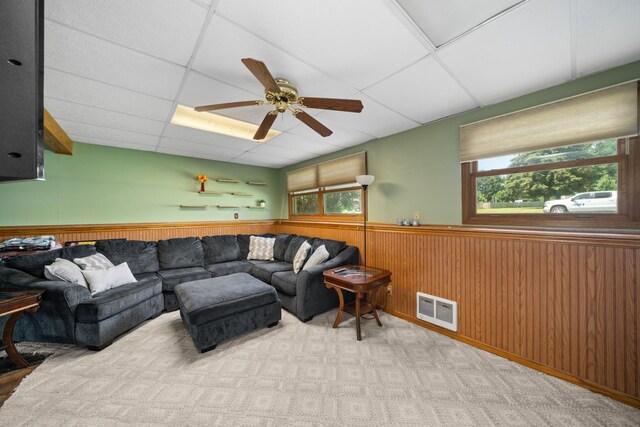 2689 Lynnville Ct, Lindenwood, IL 61049 - carpeted living area with wainscoting, a paneled ceiling, plenty of natural light, and a ceiling fan