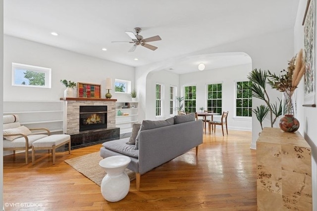 4637 N Drake Ave Unit 3, Chicago, IL 60625 - living room featuring healthy amount of natural light, arched walkways, light wood finished floors, and recessed lighting