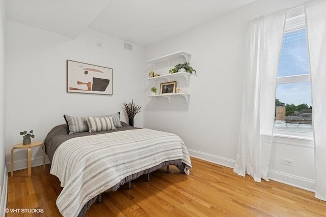 4637 N Drake Ave Unit 3, Chicago, IL 60625 - bedroom with baseboards and light wood-style floors