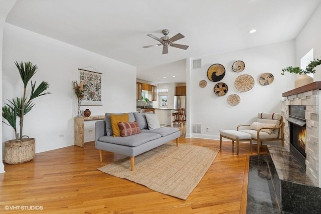 4637 N Drake Ave Unit 3, Chicago, IL 60625 - living room with a fireplace, light wood-style floors, ceiling fan, healthy amount of natural light, and recessed lighting