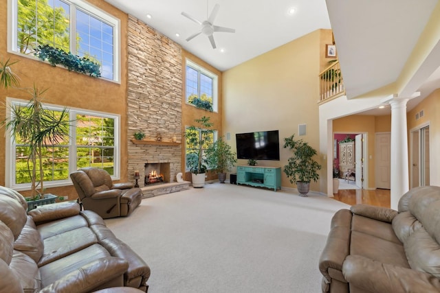 484 W Haleys Hill Ct, Palatine, IL 60074 - carpeted living room with a towering ceiling, decorative columns, a ceiling fan, a stone fireplace, and recessed lighting