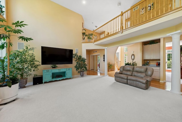 484 W Haleys Hill Ct, Palatine, IL 60074 - living area with ornate columns, carpet floors, a towering ceiling, and recessed lighting