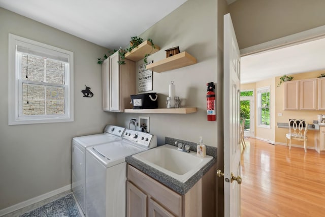 484 W Haleys Hill Ct, Palatine, IL 60074 - laundry area with washer and clothes dryer, cabinet space, and light wood-style flooring