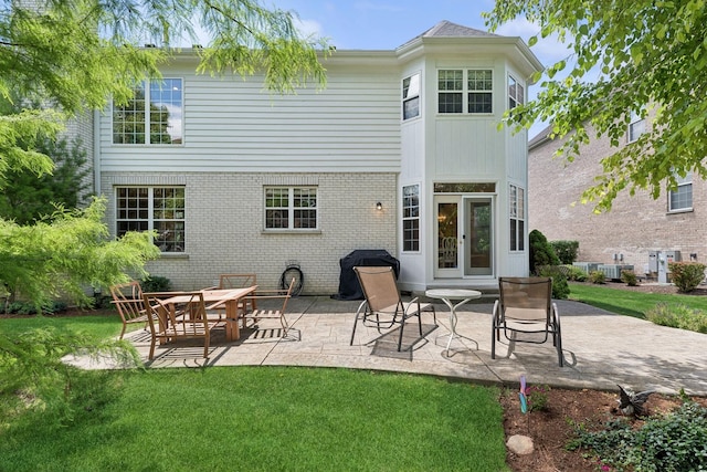 484 W Haleys Hill Ct, Palatine, IL 60074 - rear view of property featuring a lawn, a patio area, and brick siding