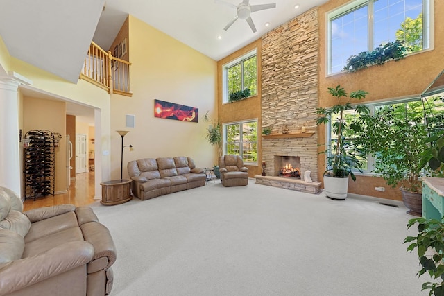 484 W Haleys Hill Ct, Palatine, IL 60074 - carpeted living room with a towering ceiling, ceiling fan, a stone fireplace, and recessed lighting